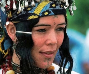 A Berber Woman showing her jewelery in a festival in Morocco