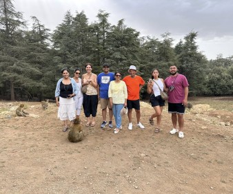 A family exploring the Atlas Mountains near Azrou with monkeys